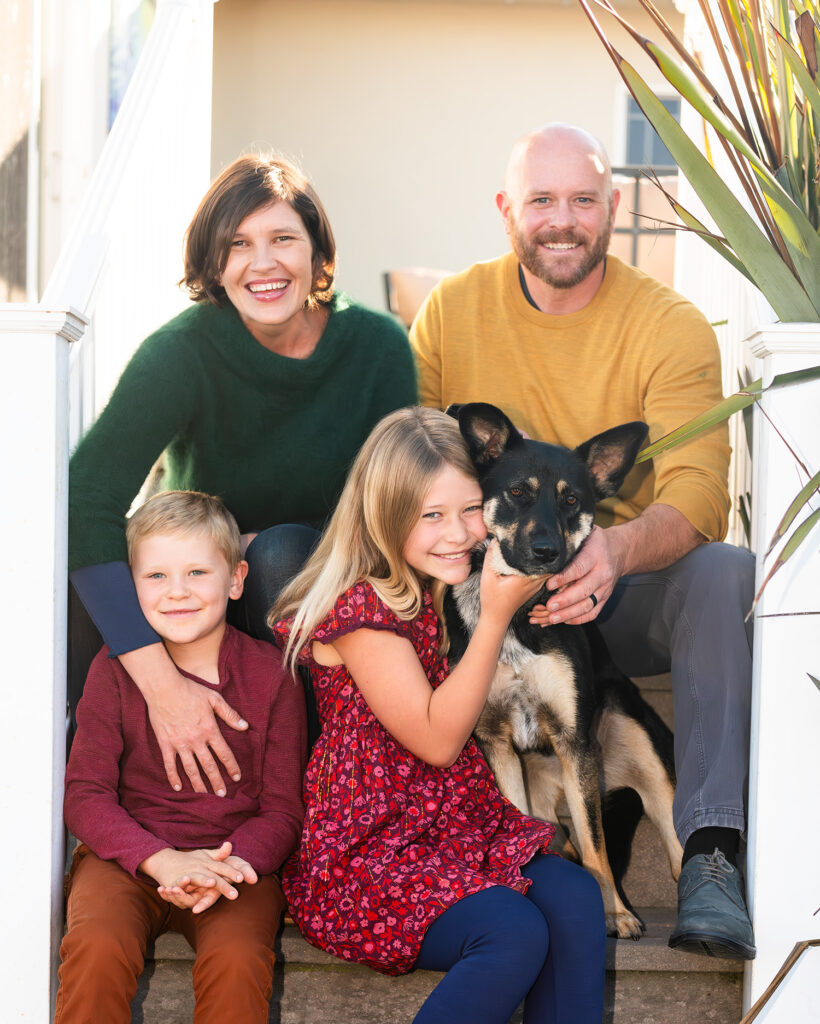 Family of four and their dog captured in their backyard of their Mill Valley home for a photo session with Marin Family Photographer