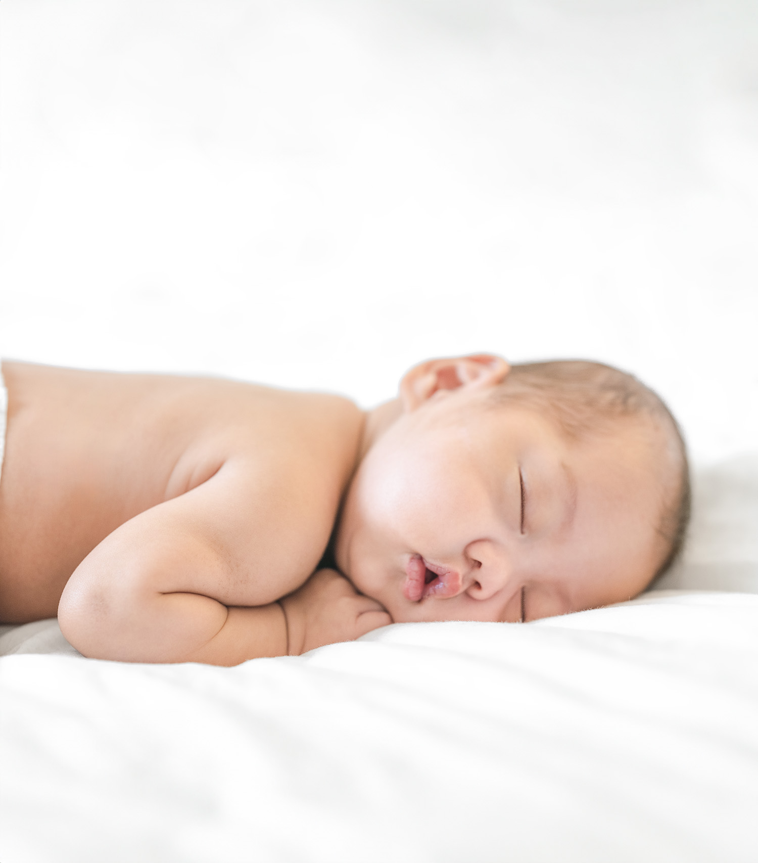 Newborn baby sleeping peacefully during an in-home photography session in Mill Valley, captured by Mill Valley newborn photographer Isela Lozano.
